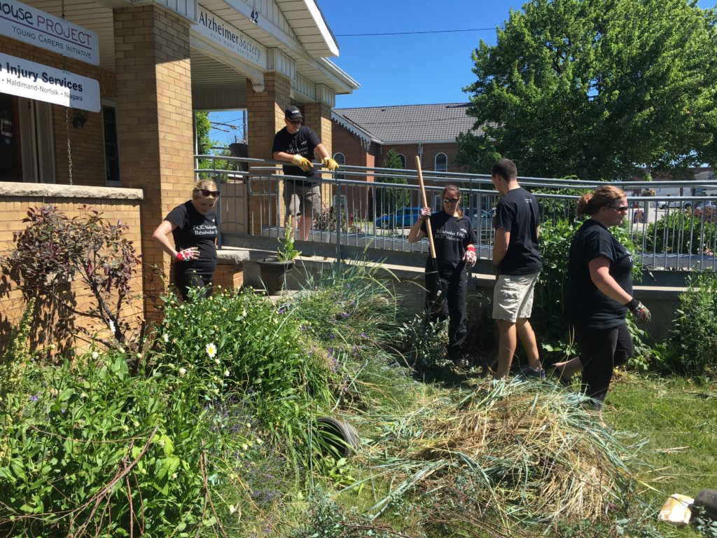 A group of volunteers from Farm Credit Canada working on the Haldimand Abilities Centre's sensory garden.