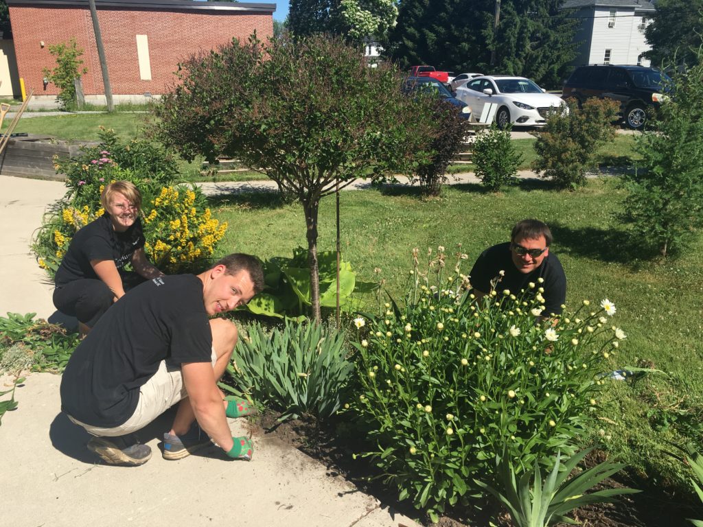 Volunteers from Farm Credit Canada busy at work in the garden.